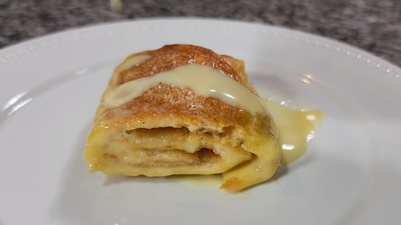 Portion of butter roll served onto a white plate