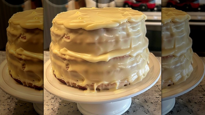 lemon cheese layer cake on white platter