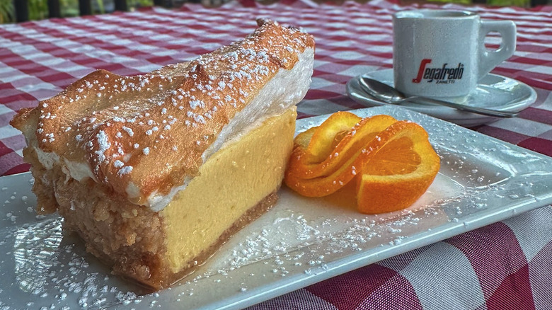 Close up of a slice of sour orange pie on a white plate
