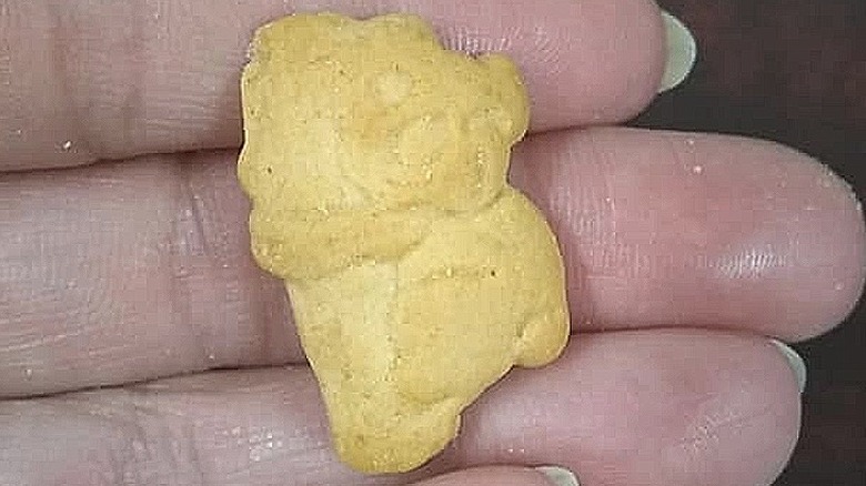 Woman holding koala animal cracker