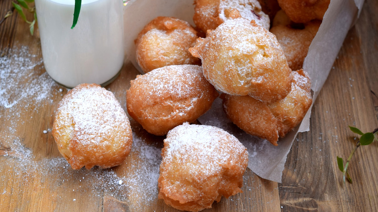 Powdered beignets on table