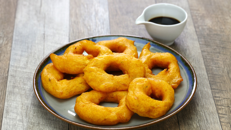 Picarones and sauce on table