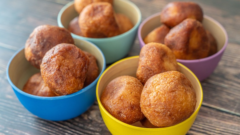 Puff puffs in colorful bowls