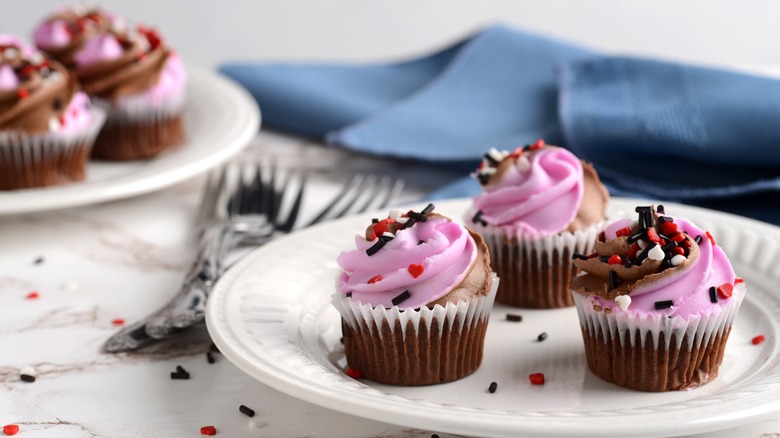 plate with three cupcakes