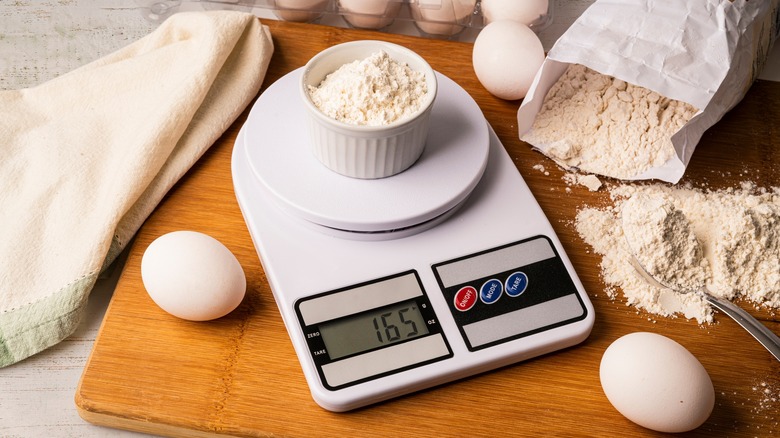 weighing flour on scale