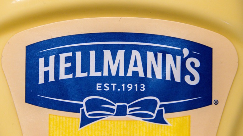 Jars of Hellman's mayonnaise sitting on a store shelf