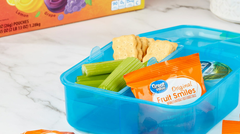 A lunchbox packed with great value fruit smiles snack packs in lemon, grape, orange and strawberry flavor