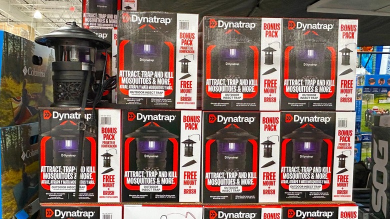Several boxes of Dynatrap 1/2 Acre LED Outdoor Insect Traps