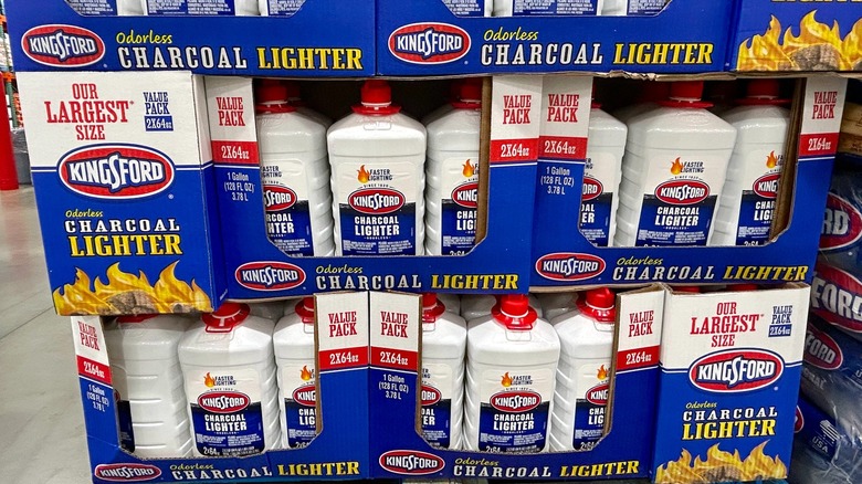 Several bottles of Kingsford Lighter Fluid in cardboard boxes