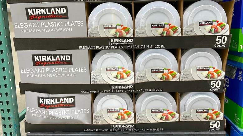 Multiple packages of Kirkland Signature Elegant Plastic Plates, Variety Pack stacked