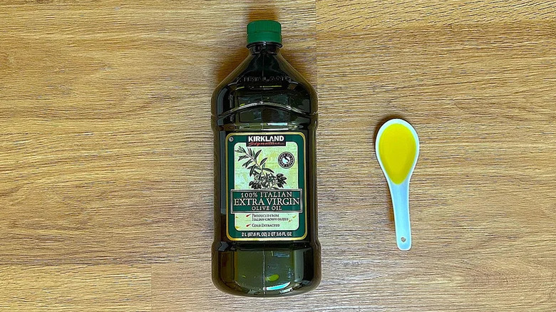 Bottle and spoon of Kirkland Signature Organic Extra Virgin Olive Oil