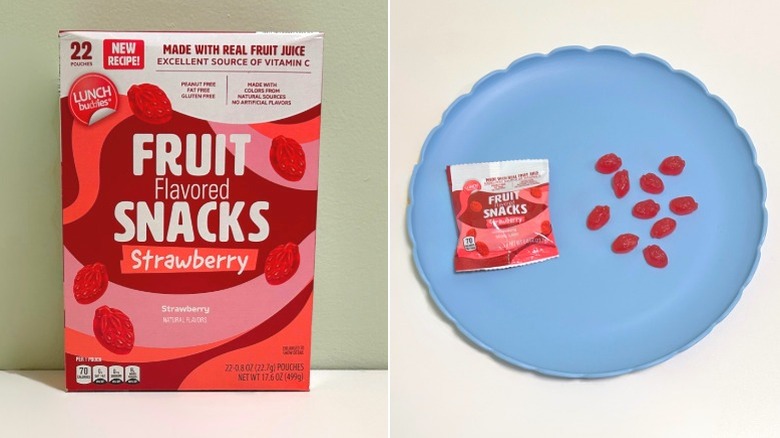 A box of Lunch Buddies Fruit Flavored Strawberry Snacks next to a blue plate with strawberry gummy snacks