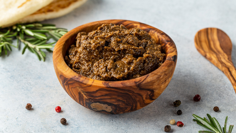 Wooden bowl filled with Tapenade