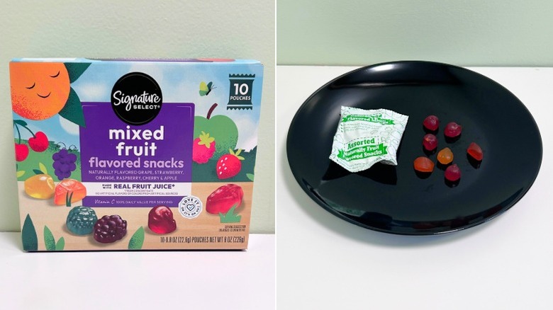 A box of Signature Select Fruit Snacks next to a black plate of fruit snacks