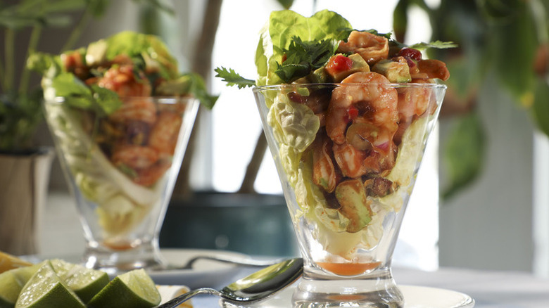 Two glasses filled with Shrimp Cocktail Salad