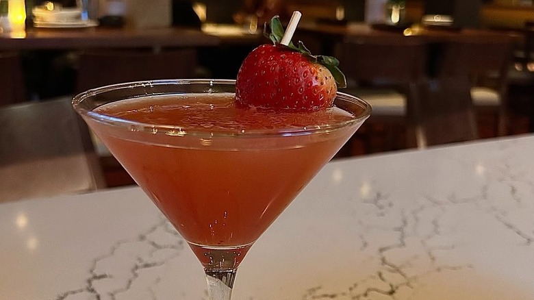 Bonefish Grill's Rose Sidecar Martini, garnished with a whole strawberry.