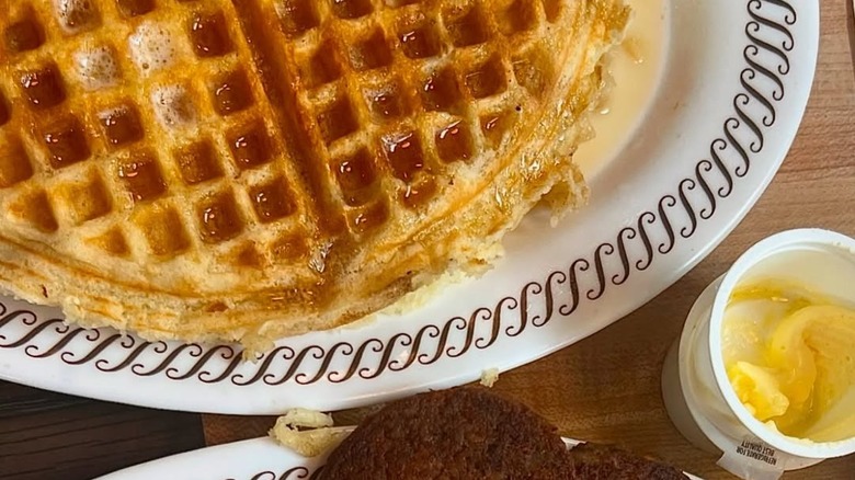 Photo of a Waffle House waffle with syrup.