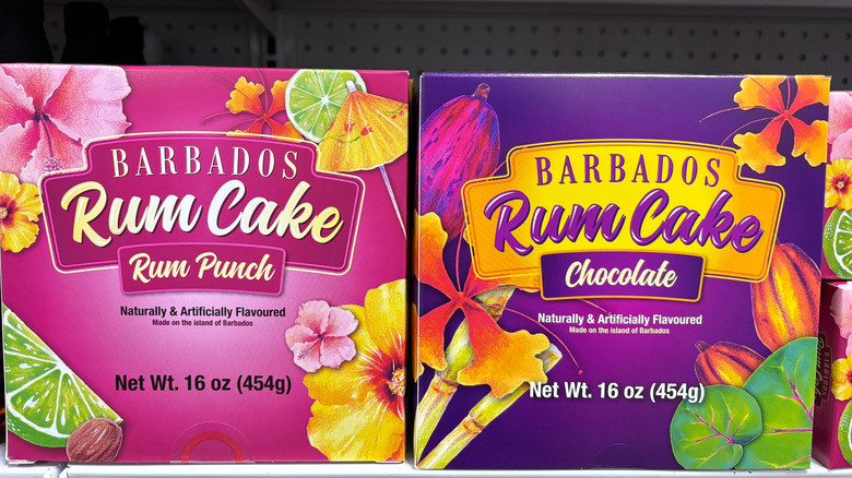 Two boxes of rum cake on a grocery store shelf
