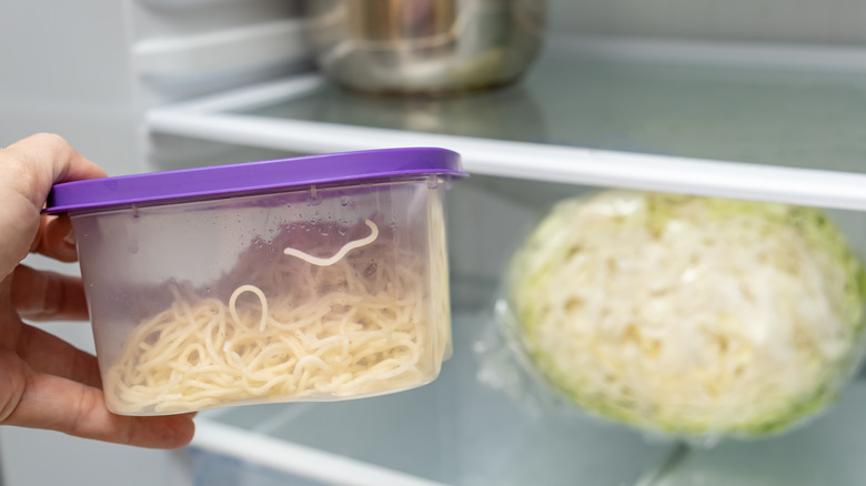 container of leftovers in fridge