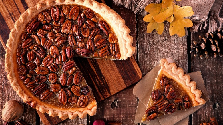 A pecan pie with a single slice removed