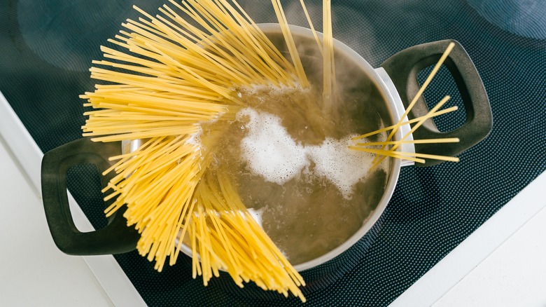 spaghetti in a pot of water