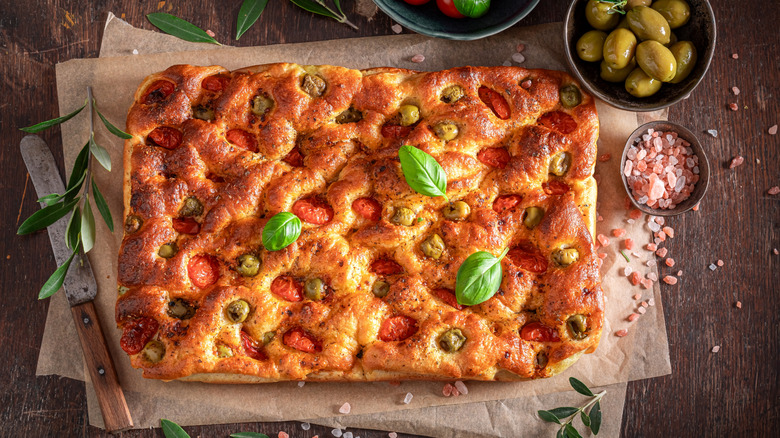 Homemade focaccia bread with olives and tomatoes