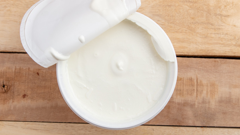 Plastic container of Greek yogurt