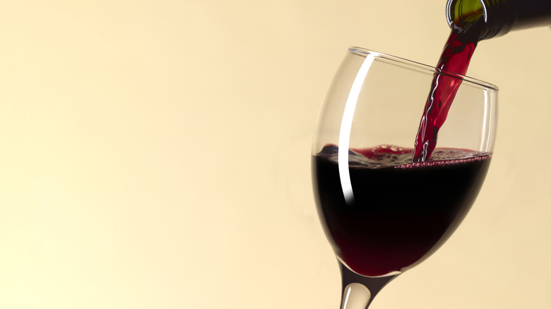 Pouring a glass of red wine