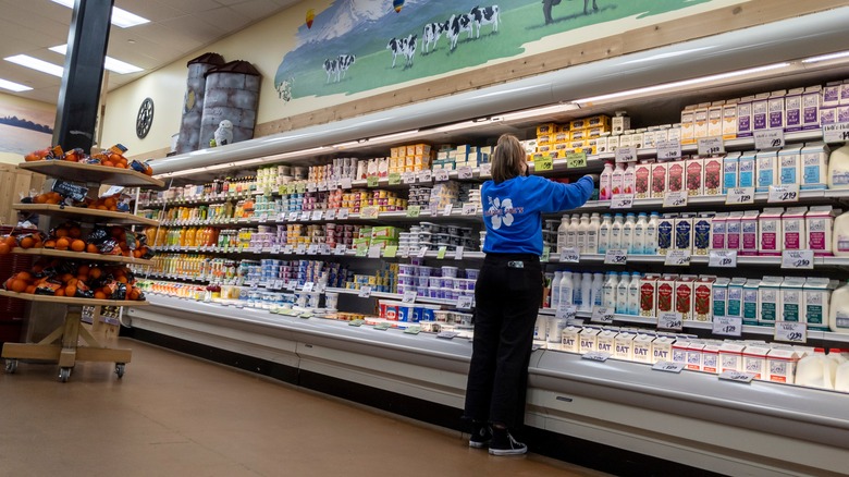Trader Joe's employee checking shelves