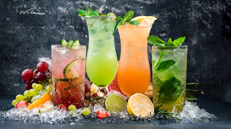 Variety of fruity cocktails and garnishes with ice