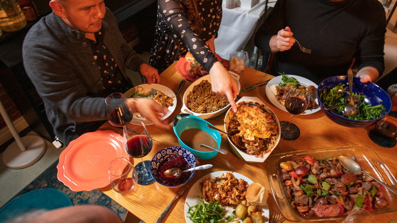 Guests enjoying potluck dinner