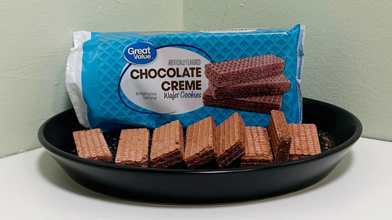 A bag of Great Value Chocolate Creme Wafer Cookies on a plate with wafer cookies