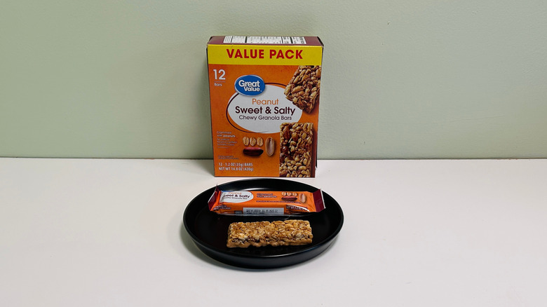A box of Great Value Chewy Granola Bars beside a plate with a granola bar
