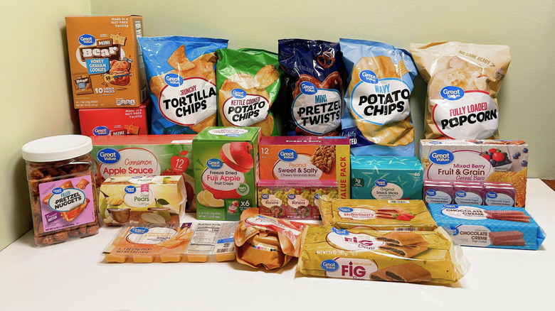 Many Great Value brand snacks together on a white counter