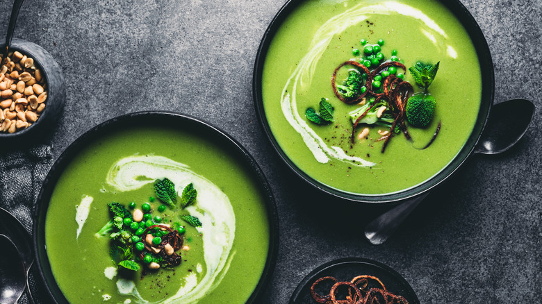 Garnished pea soup in bowls