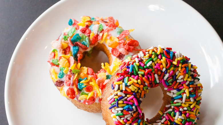 Cake donuts topped with sprinkles & Fruity Pebbles