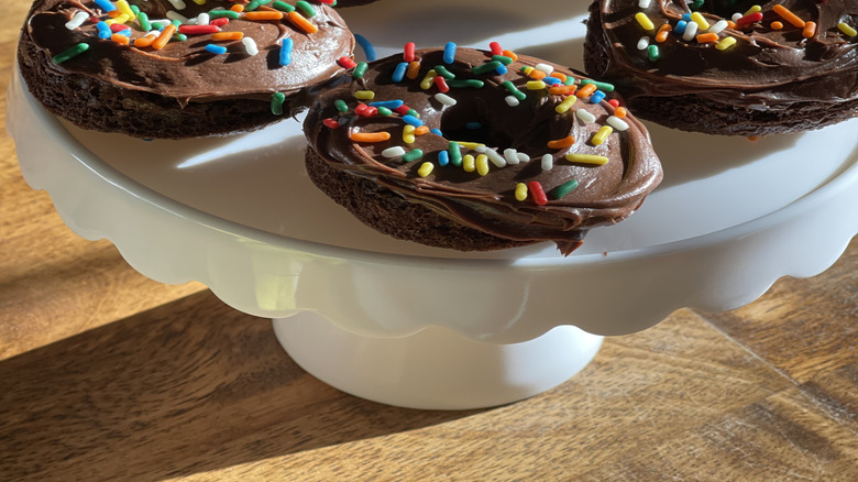 Chocolate frosted donuts with colored sprinkles