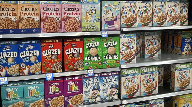 Various boxes of cereal on grocery store shelves
