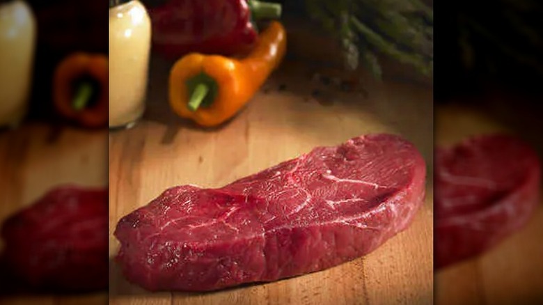 bison steak on cutting board