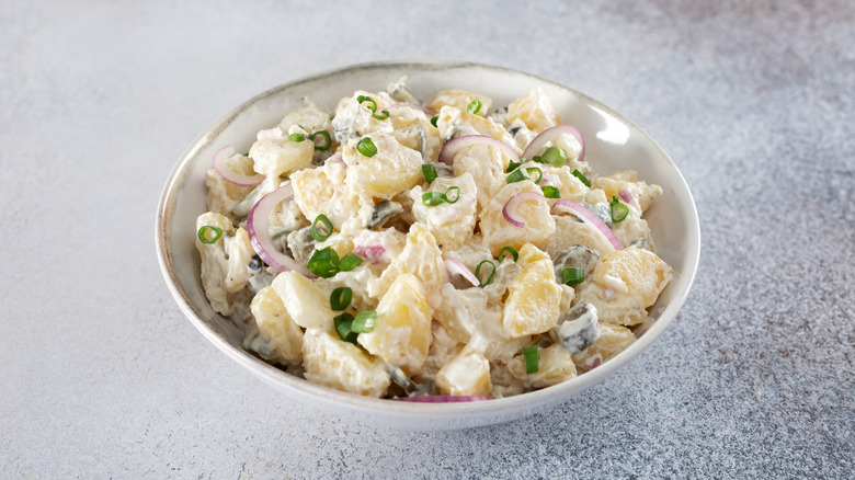 White bowl filled with potato salad