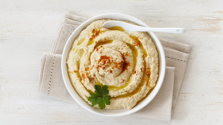 White bowl filled with homemade hummus