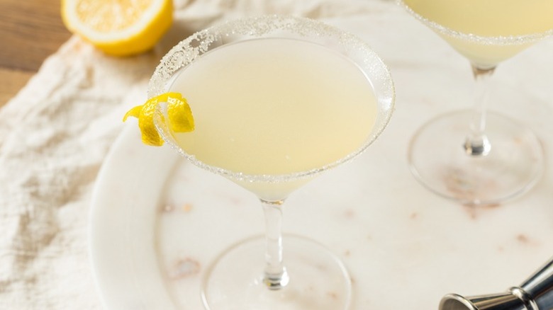Lemon drop martini in a glass, with a twist of lemon and a sugar rim