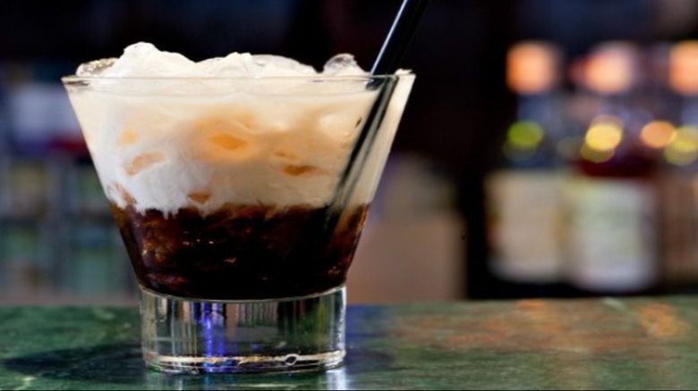 A layered white Russian in a short glass with ice