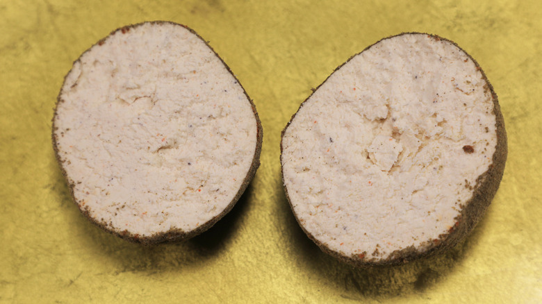 Two slices of shanklish cheese on table