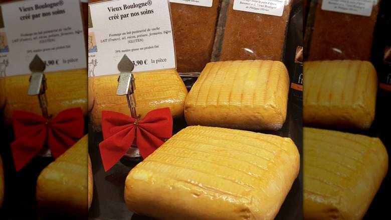 Several squares of Vieux Boulogne cheese in a shop