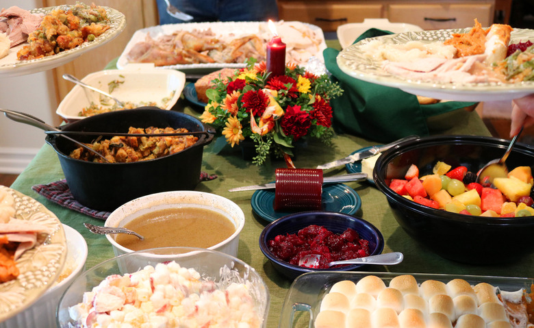 Offer to help cook or bring a dish
