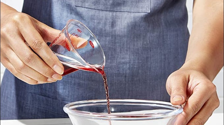 pouring from a measuring cup