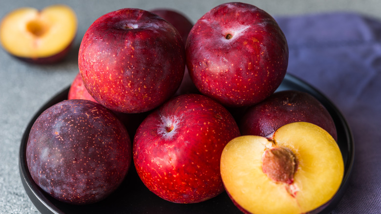 bowl full of plums