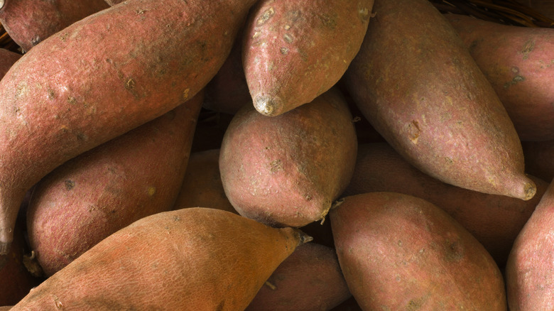 Assorted sweet potatoes in pile