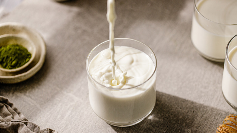 Pouring a glass of milk
